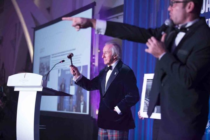 Live auction with celebrity gavel holders — going once, going twice